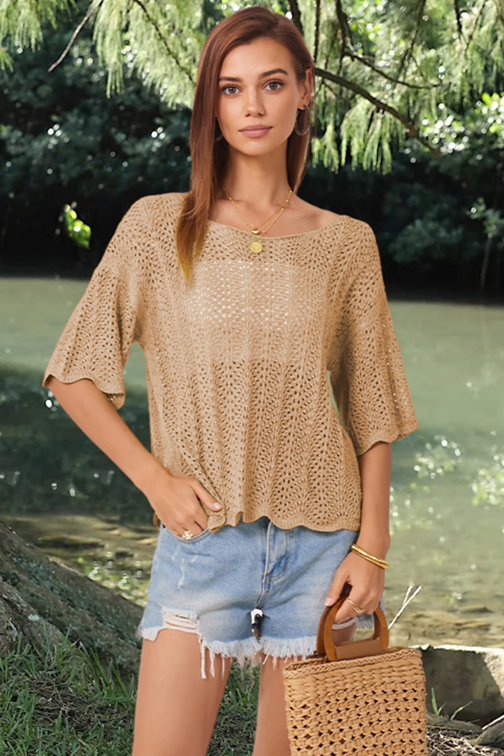 Khaki open-knit blouse with scalloped sleeves and a boat neck, styled with denim shorts.