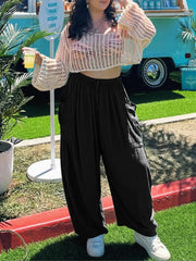 Black linen balloon trousers with cargo pockets and drawstring waist