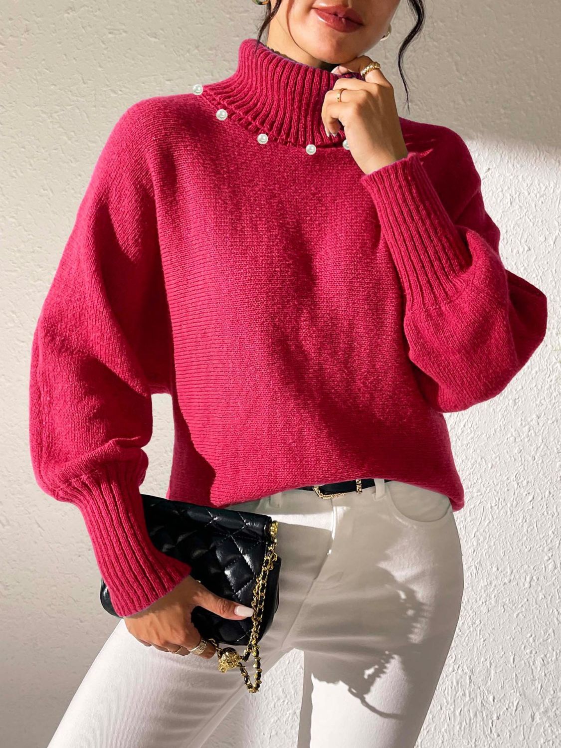 Deep Red knit sweater with pearl details on the turtleneck and dolman sleeves.