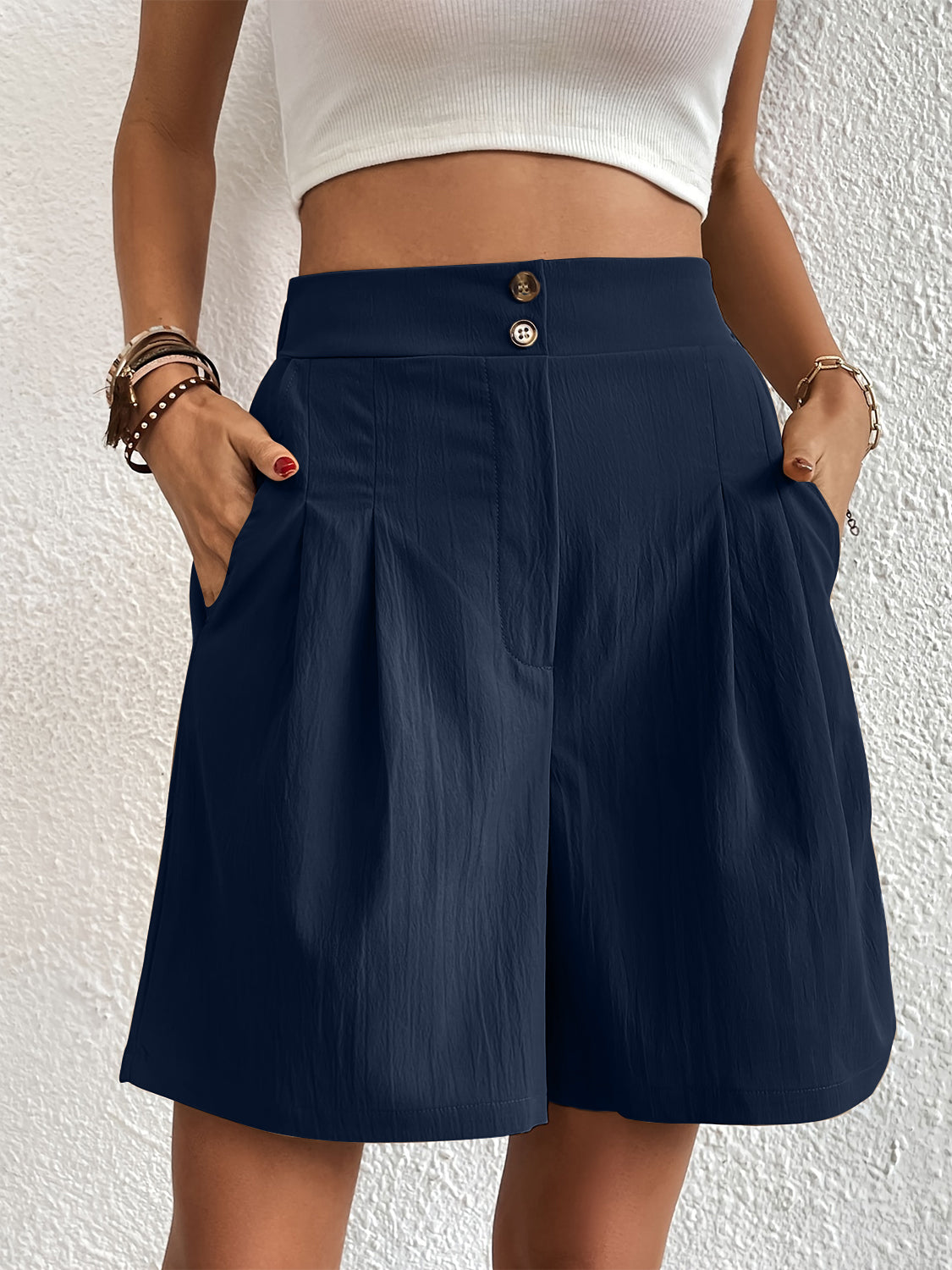 Dark Blue pleated front bermuda shorts with button detail and pockets.