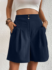 Dark Blue pleated front bermuda shorts with button detail and pockets.