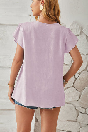 Lilac textured V-neck blouse with pleated flutter sleeves.