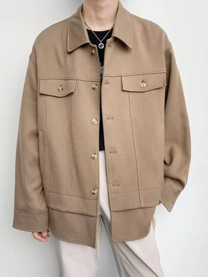 Oversized Khaki Button-Down Jacket with dual chest pockets and button cuffs.