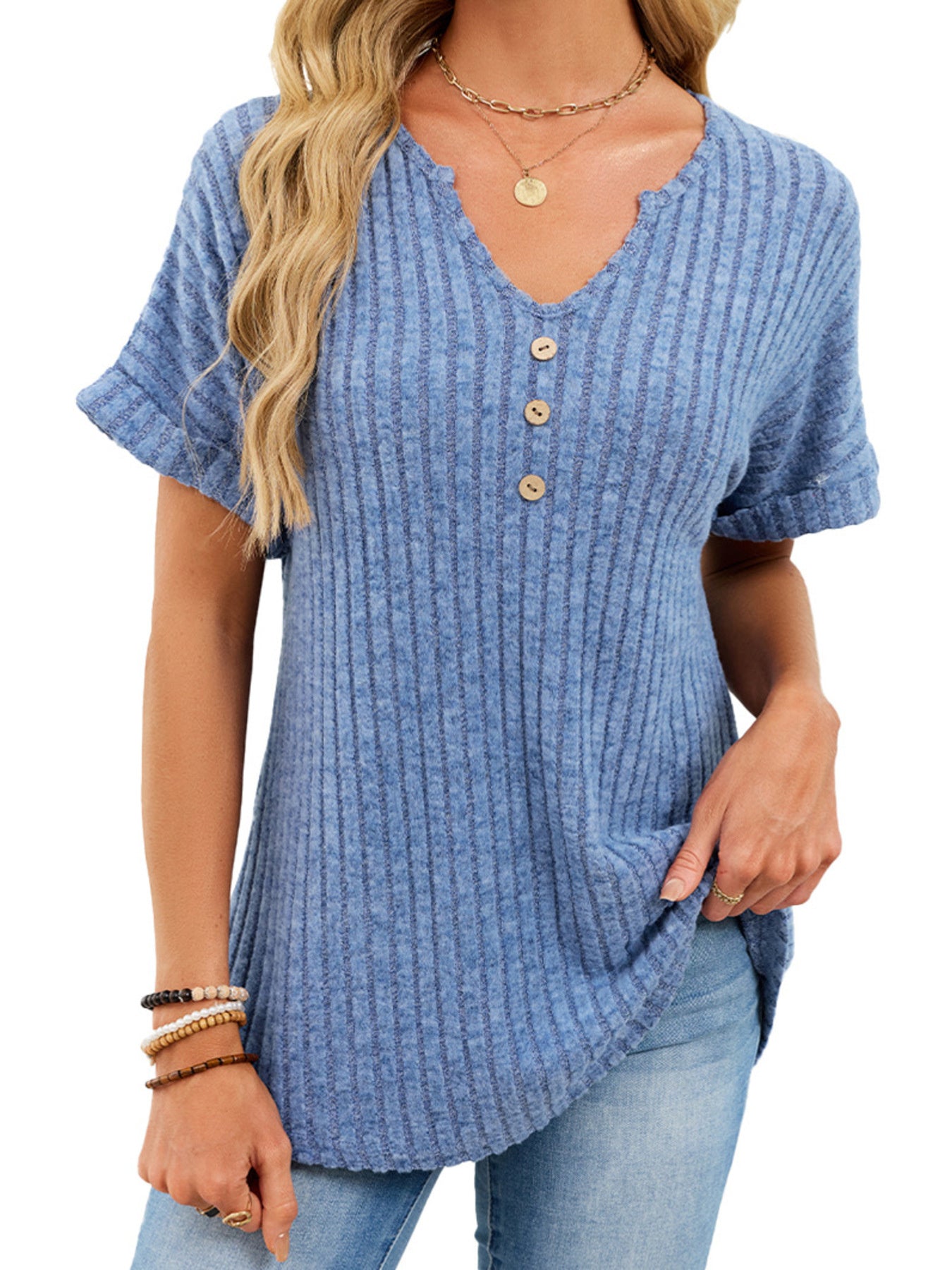 Dusty blue ribbed knit short sleeve t-shirt with decorative buttons and a curved hem.