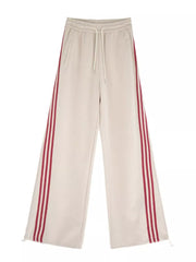 Apricot maternity joggers with side stripes and drawstring waist