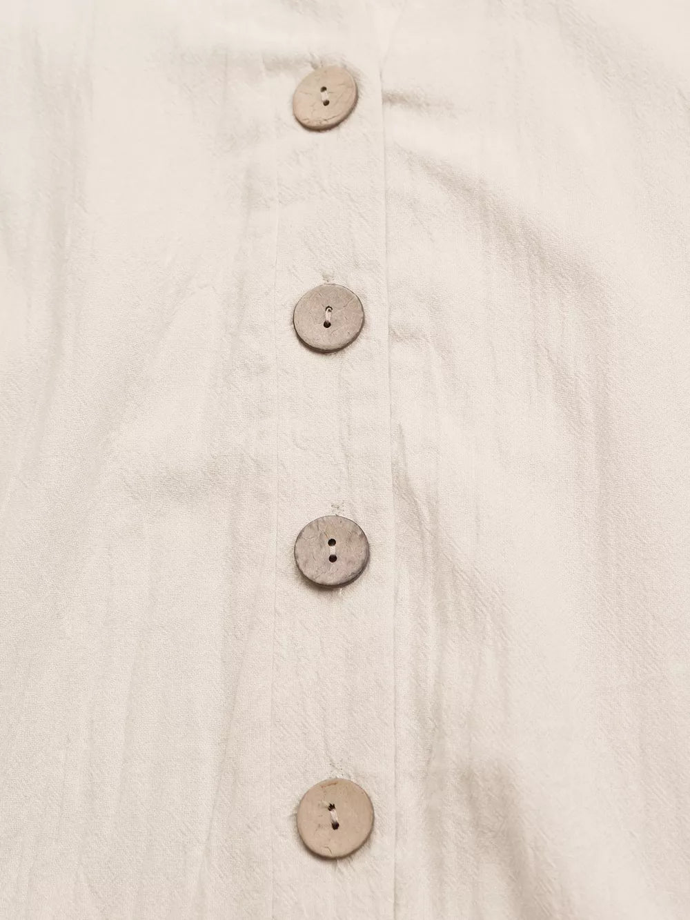 Apricot cotton mini dress with V-neck and wooden button detail