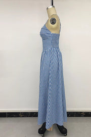 Blue gingham midi dress with smocked bodice and knot-front detail.