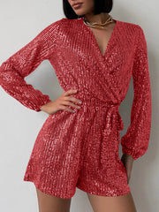 Scarlet sequin wrap romper with blouson sleeves and tie waist