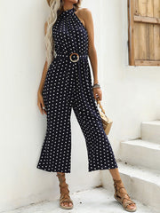 Navy polka dot wide-leg romper with halter neck and belted waist