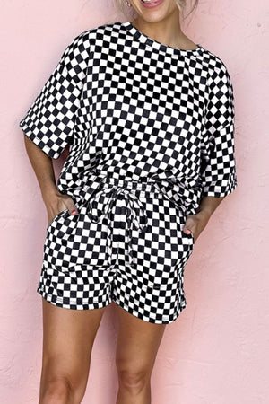 Black checkered loungewear set with short sleeves and drawstring shorts.