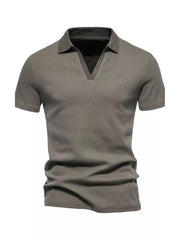 Men's light gray cotton blend polo shirt with notched collar and short sleeves.