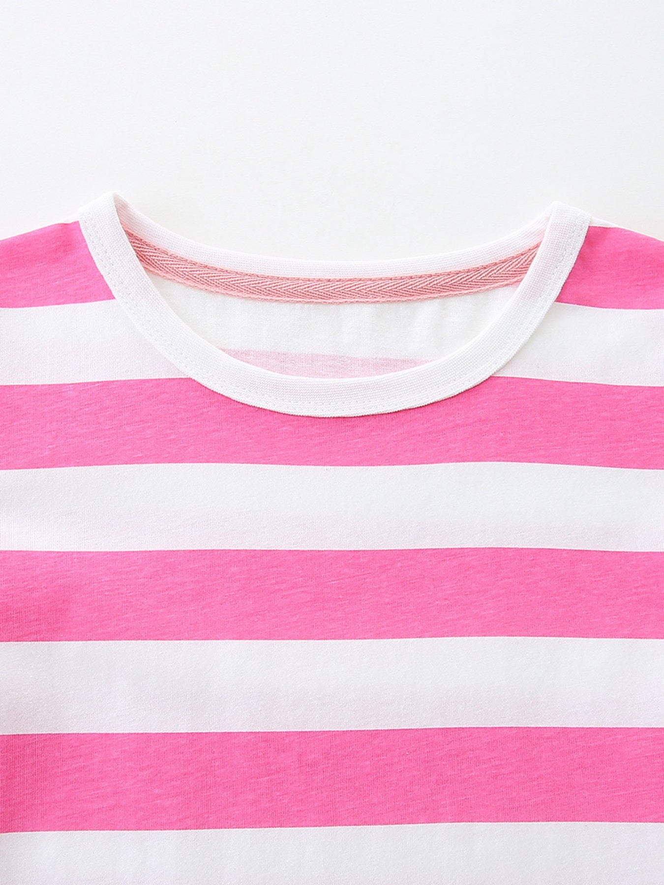Toddler dress with pink and white stripes, crew neck, and decorative trim detail.