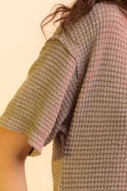 Relaxed waffle knit top in taupe with short sleeves and a V-neck.