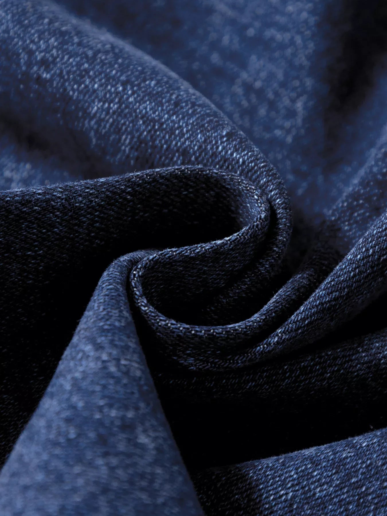 Patch pocket wide-leg jeans in medium wash denim, showing fabric texture.