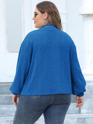 Textured balloon sleeve mock neck sweater in Royal Blue with ribbed knit detail.