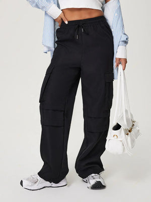 Black utility cargo pants with wide legs and multiple pockets.