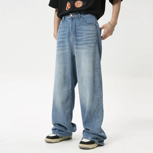Oversized baggy denim trousers in medium wash, featuring a relaxed fit and casual style.