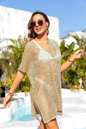 Rainbow crochet tunic cover-up with V-neck, short sleeves, and side slits.
