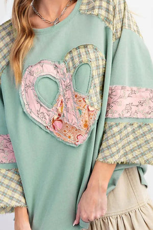 Patchwork heart raglan top in tan with plaid and floral details.