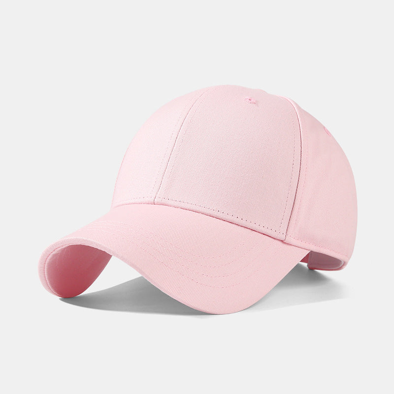 Pink cotton baseball cap with adjustable strap and 6-panel construction.