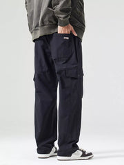 Black oversized cargo pants with multiple pockets and adjustable waist detail.