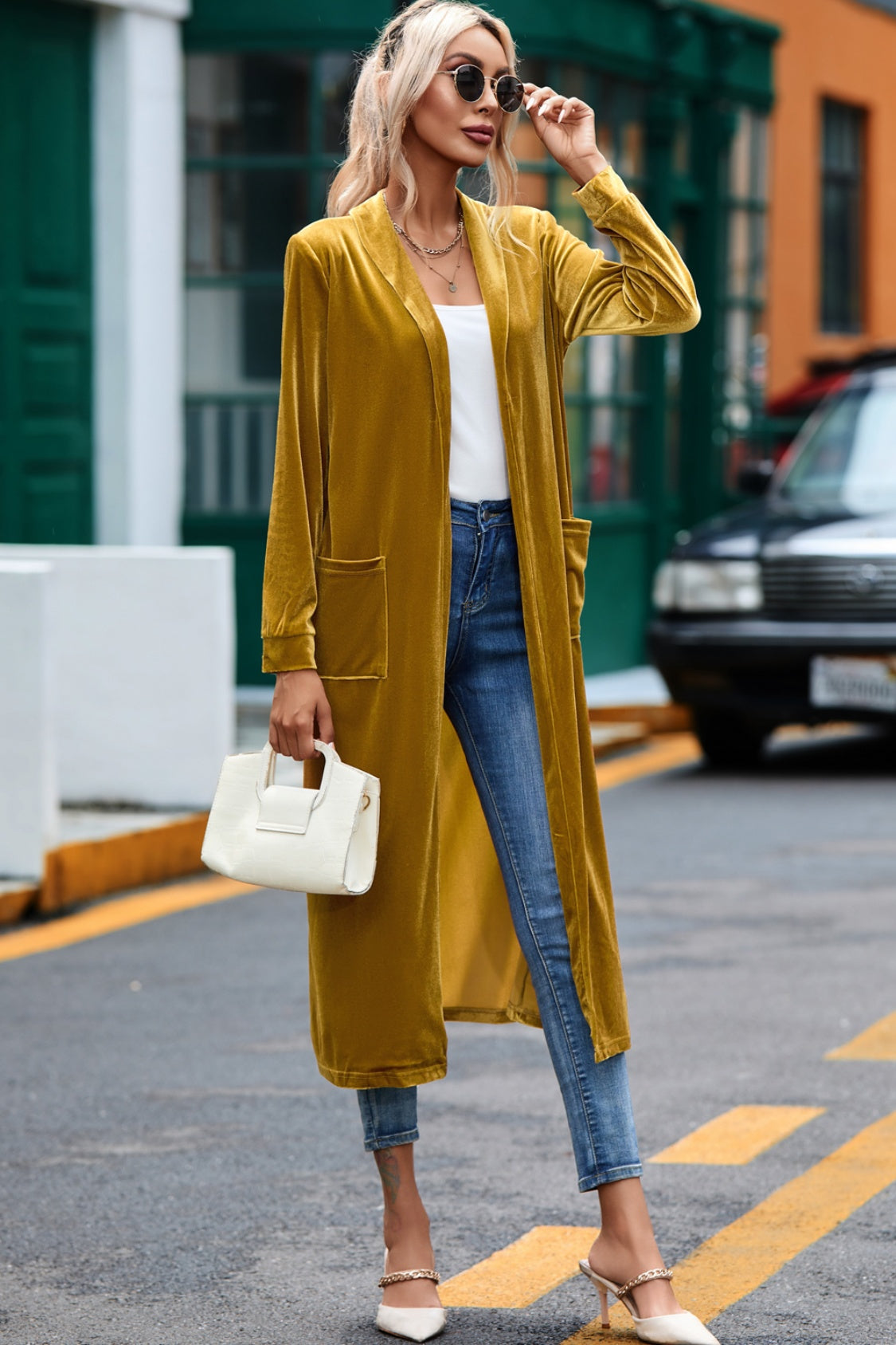 Mustard velvet duster coat with pockets, open front, long sleeves, and floor length.