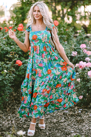 Green floral ruffle-sleeve tiered midi dress with square neckline and colorful blooms.