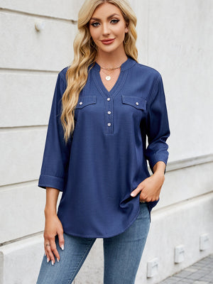 Dark navy denim henley blouse with two chest pockets and a v-neck.