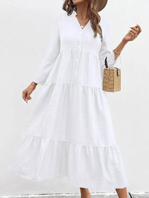 White tiered ruffle hem v-neck dress with button front and bell sleeves.