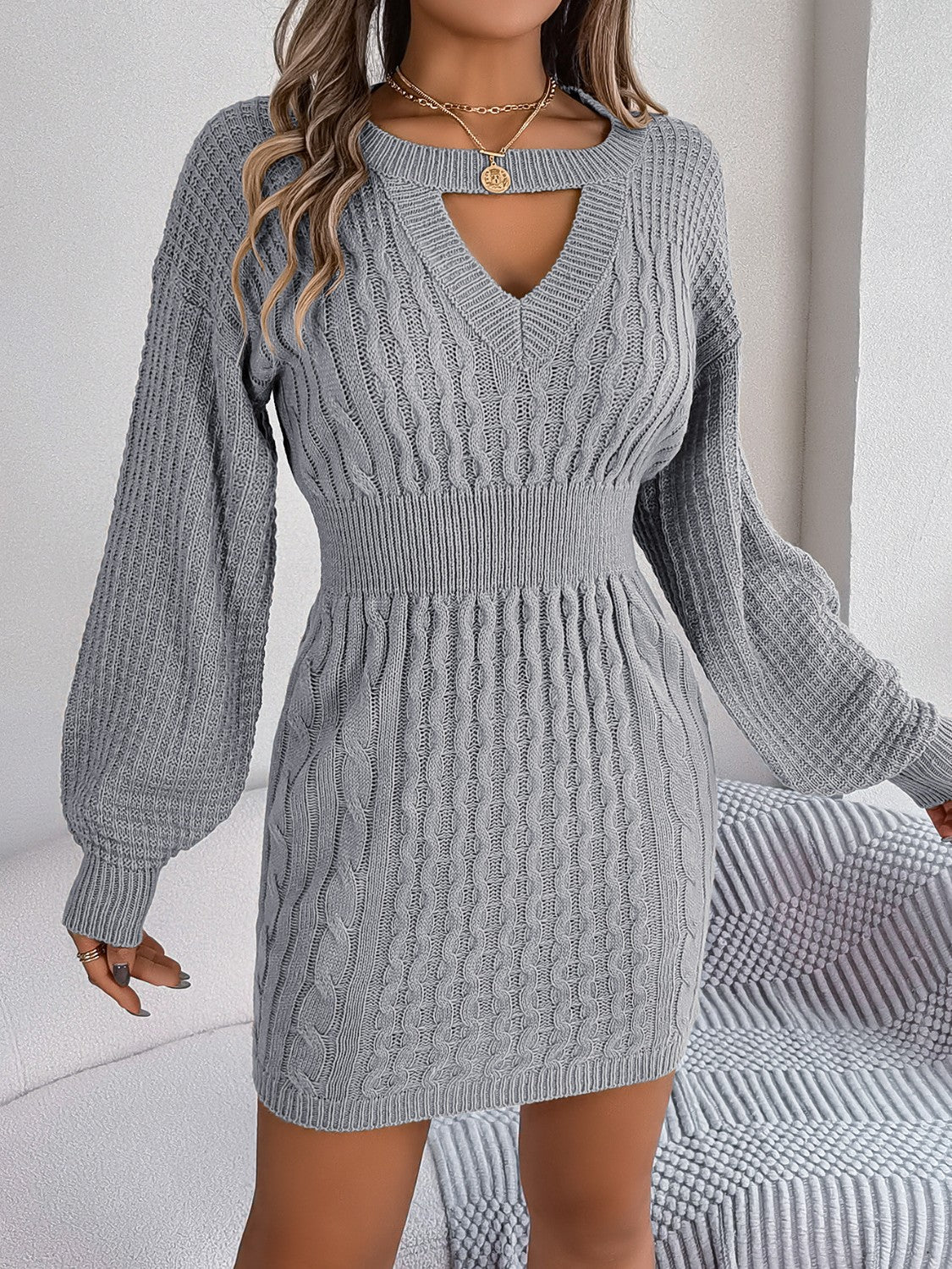 Cable knit mini dress in charcoal with keyhole neckline and balloon sleeves