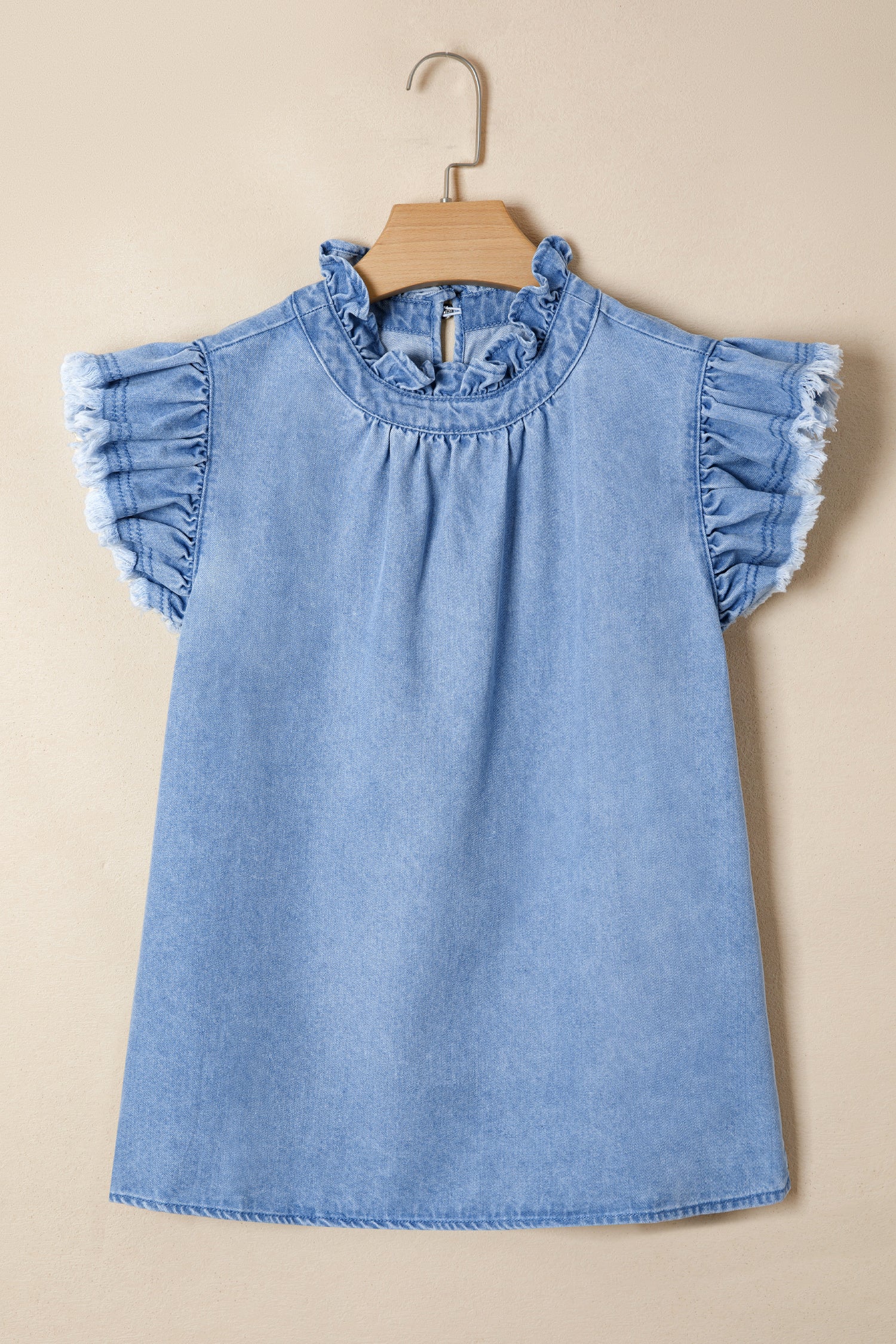 Frilled collar distressed denim top with ruffled cap sleeves and frayed hem.