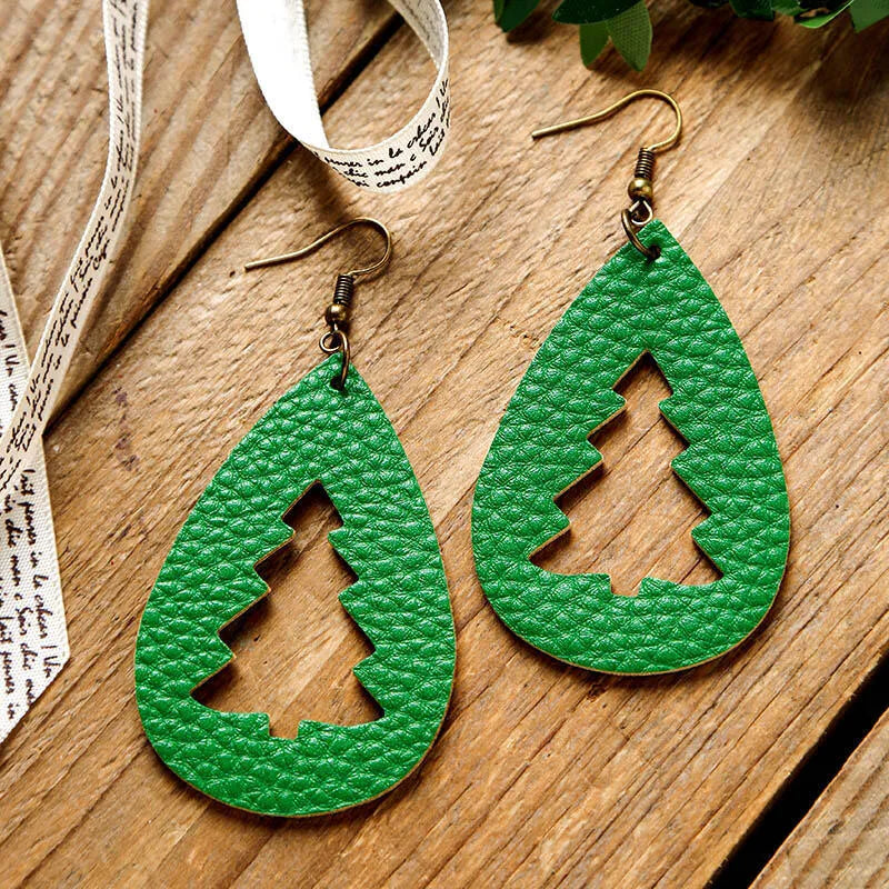 Green teardrop earrings with cutout Christmas trees and bronze hooks