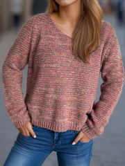 Textured slouch v-neck sweater in dusty pink with multi-color flecks, acrylic knit.