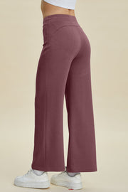 Soft drape wide leg lounge pants in mauve with a high waist and flared leg.