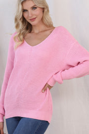 Relaxed knit v-neck pullover sweater in blush pink acrylic with a relaxed fit.