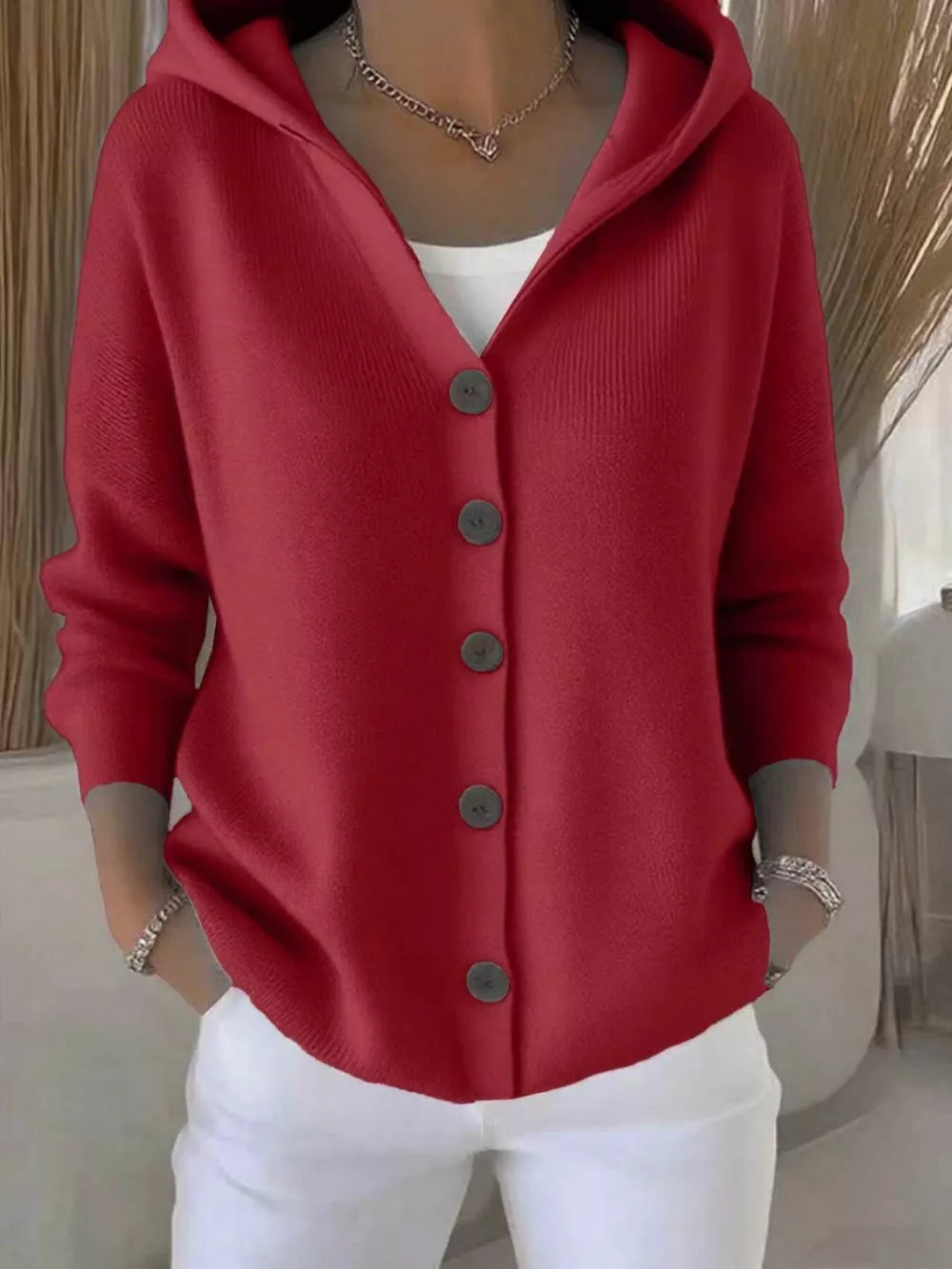 Burgundy hooded knit cardigan with button front and ribbed texture.