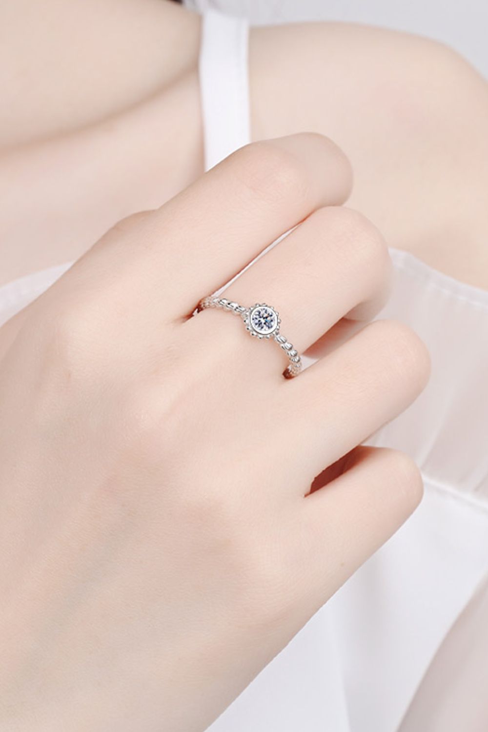 Silver beaded band moissanite solitaire ring with a 0.3 carat stone.
