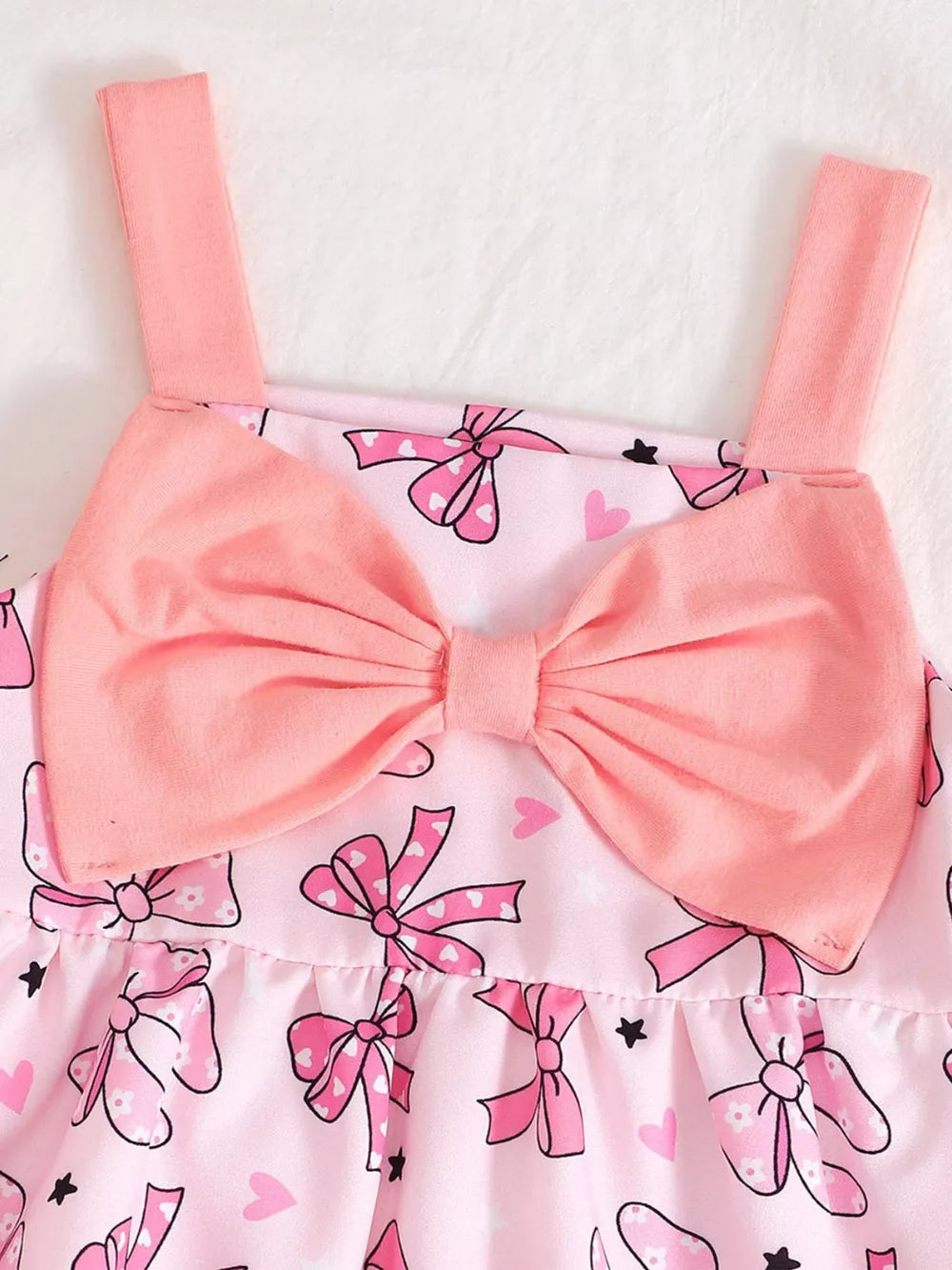 Pink baby dress with bow print and large front bow detail