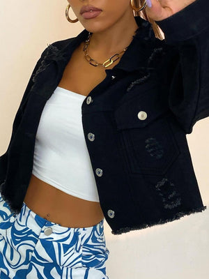 Black cropped distressed denim trucker jacket with frayed hem and collar.