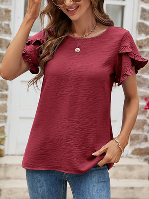 Burgundy t-shirt with textured fabric and ruffled cap sleeves.