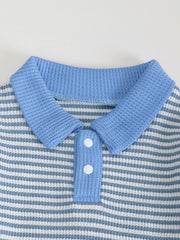 Children's blue and white striped polo shirt with waffle knit texture and two white buttons.