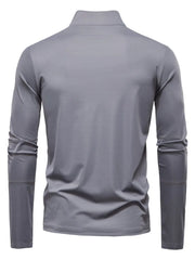 Performance zip-neck tee in gray with structured shoulders and long sleeves.