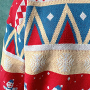Festive Fair Isle knit jumper in red and sky blue with snowman and snowflake patterns.