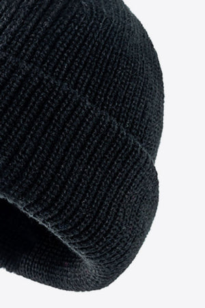 Black ribbed knit beanie with folded edge detail