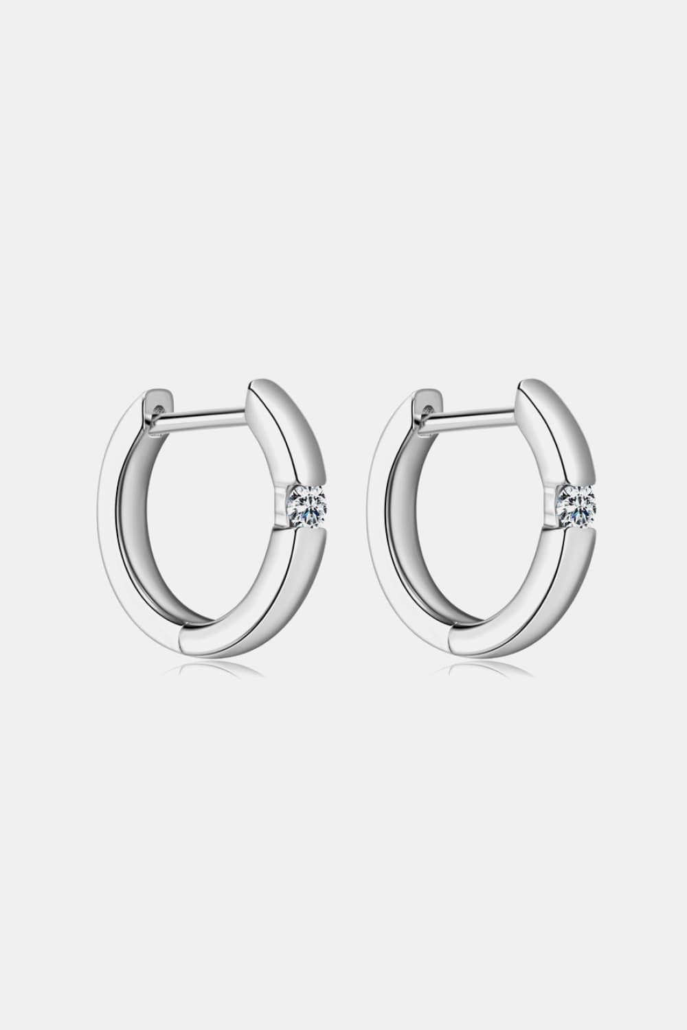 Silver pavé point huggie hoop earrings with a single stone detail