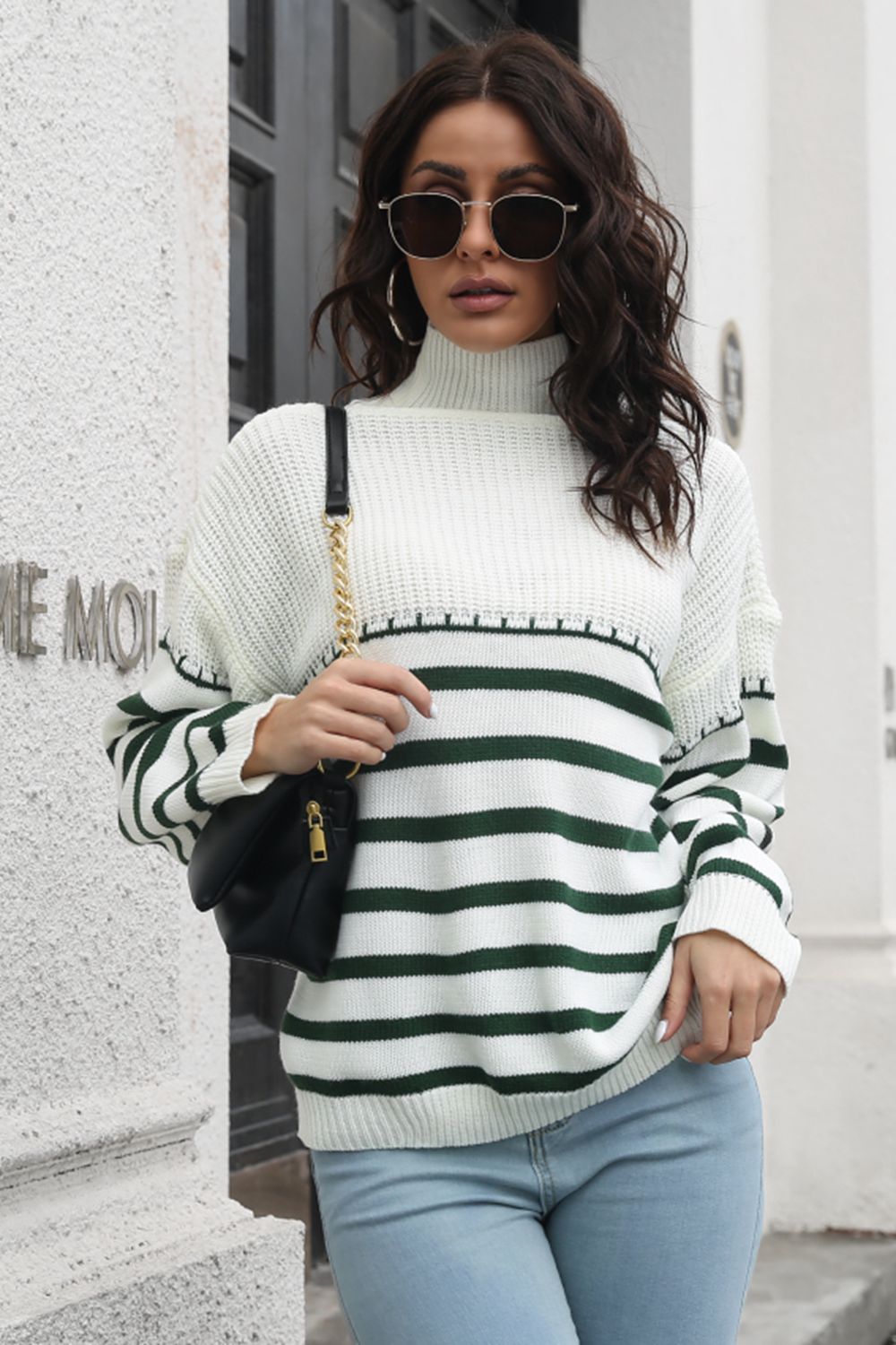 Turtleneck knit sweater with green and white Breton stripes and a textured yoke.