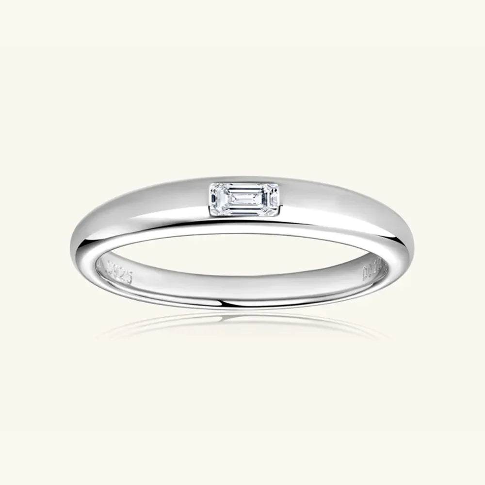 Silver baguette cut moissanite band ring with a single rectangular stone.