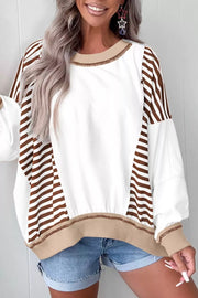 Chic colorblock sweatshirt with white body, brown stripe sleeves, and contrast stitching details.