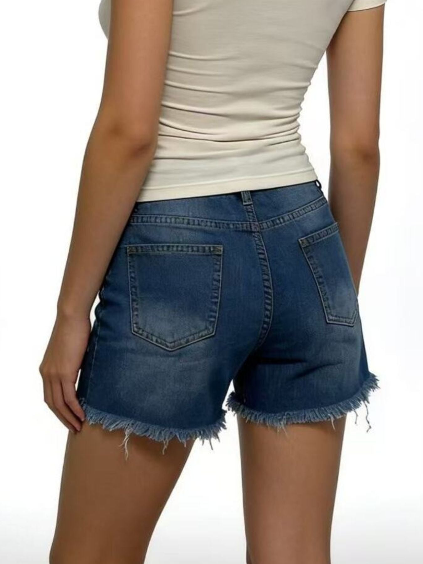 Women's dark blue distressed denim shorts with frayed hem and five-pocket styling.