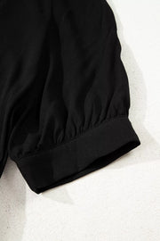 Black maternity maxi dress sleeve detail with gathered fabric and elastic cuff